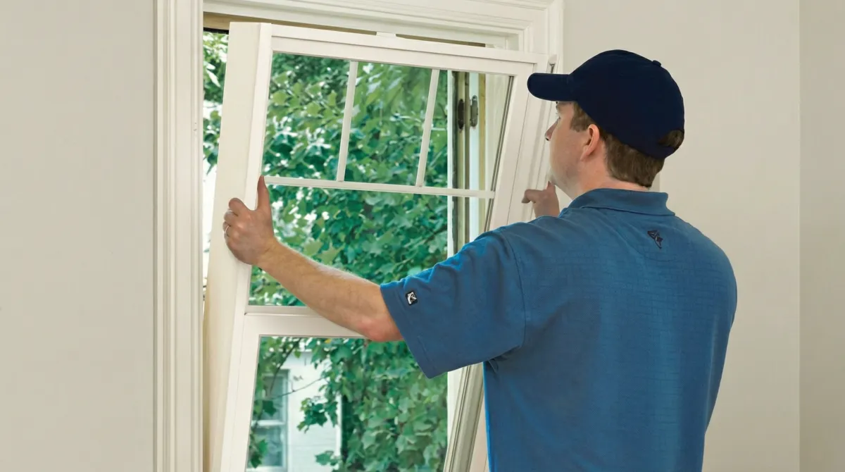 Professional contractors performing a residential window insulation and replacement service in Miami, FL